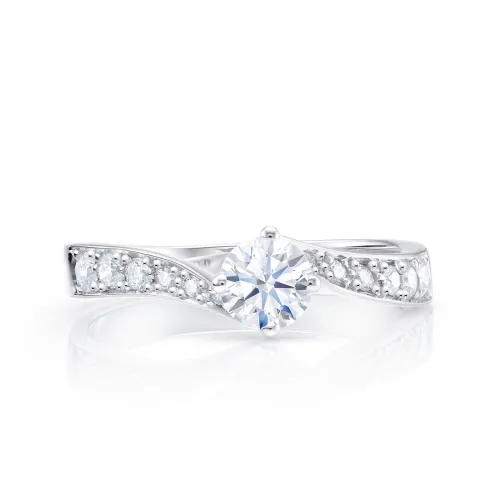 Anillos de oro blanco de 18K de compromiso con diamante central de 0.19 cts y brillantes de 0.17 F VS1