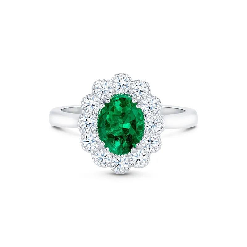Anillo oro blanco de 18K de Esmeralda Oval con Orla de Brillantes