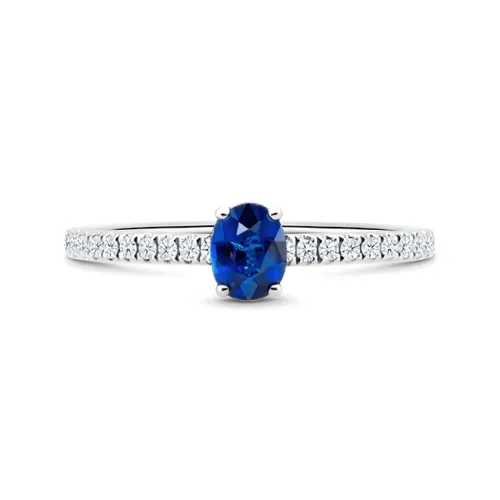 Anillo media alianza en oro de 18K con zafiro de 0.35 cts y brillantes de  0.13 cts F/G VS