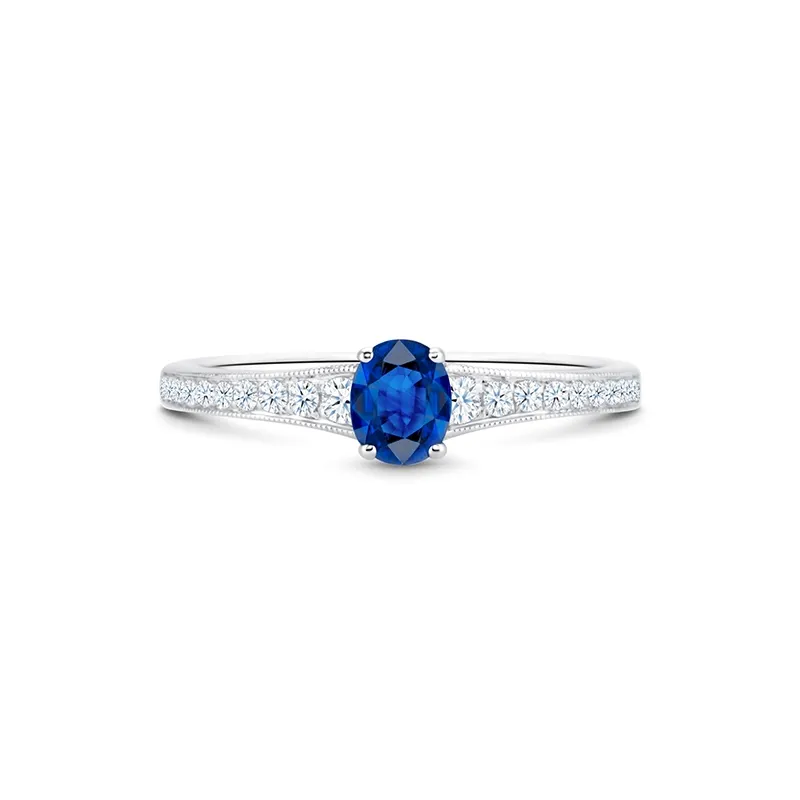 Sortija de oro de 18K con zafiro azul natural de 0.73 quilates y diamantes en el brazo F/G VS