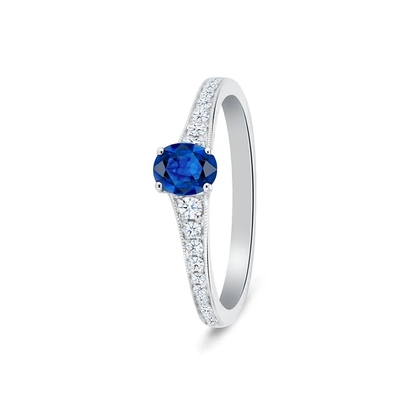 fotografia de Sortija de oro de 18K con zafiro azul natural de 0.73 quilates y diamantes en el brazo F/G VS
