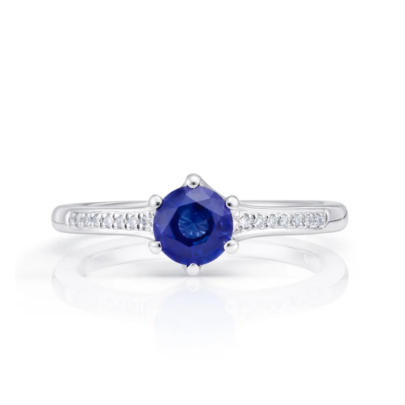 Anillo de oro blanco de 18k con zafiro azul de 0.46 cts y diamantes de peso  0.06 cts