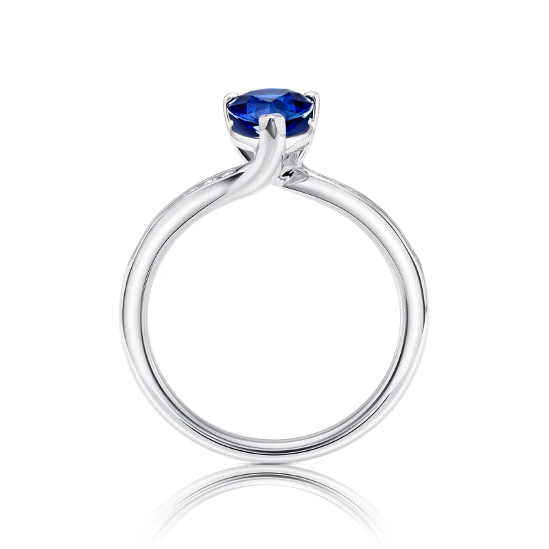 Imagen de Anillo de Oro de 18K con zafiro de talla pera con diamantes en el brazo color F pureza VS1