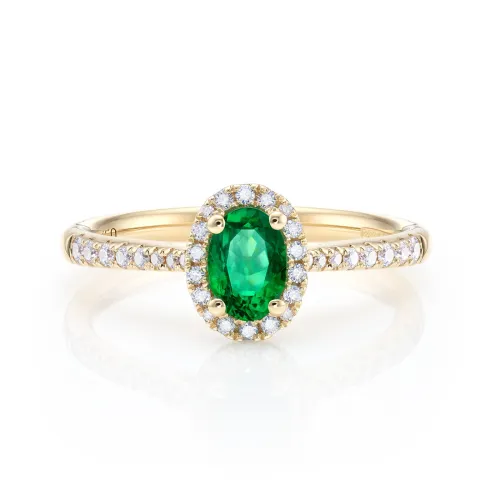 Anillo de oro 18K con Esmeralda de 0.40 cts talla oval con diamantes de 0.15 cts