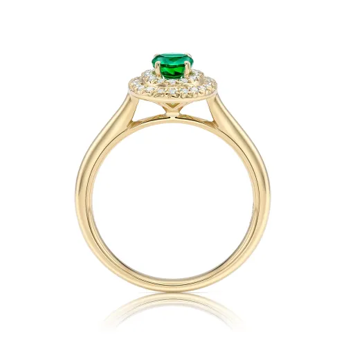 Anillo clásico con una Esmeralda de talla Oval rodeada por una fina orla de brillantes