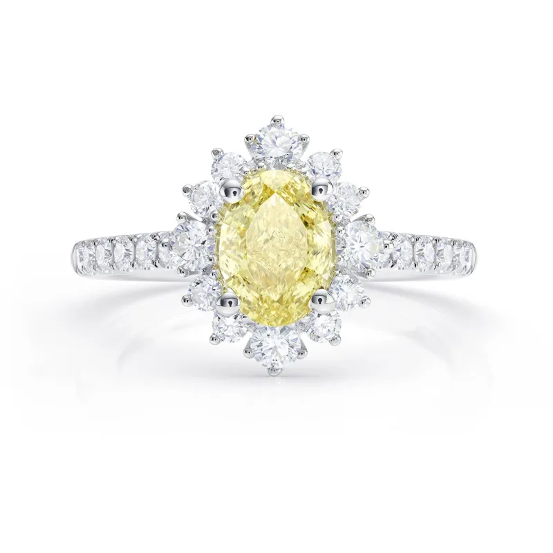 Anillo oro 18K con diamante amarillo oval fancy Intense y brillantes en orla