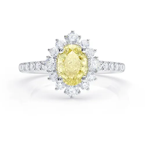 Anillo oro 18K con diamante amarillo oval fancy Intense y brillantes en orla